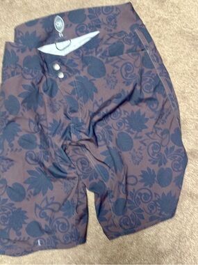 Club Ride Apparel Women's Brown Floral Bike Shorts with Black Pattern